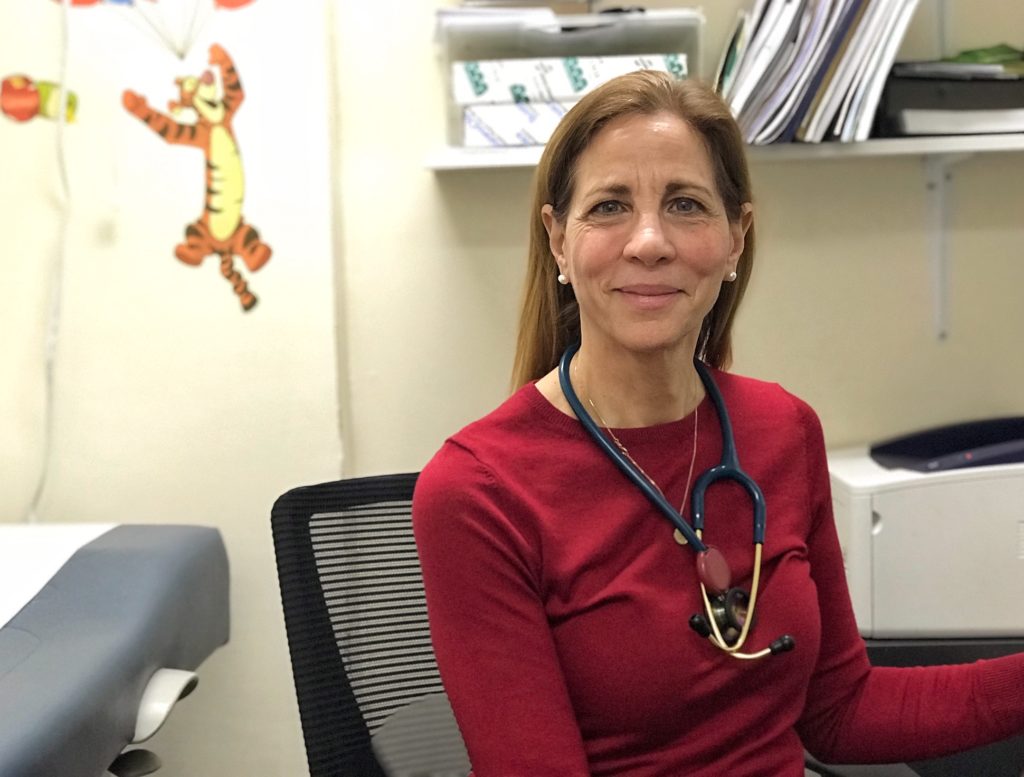 Care For the Homeless nurse practitioner, Joy Favuzza sitting in her office at the Jackson Family Residence Health Center in the Bronx. 